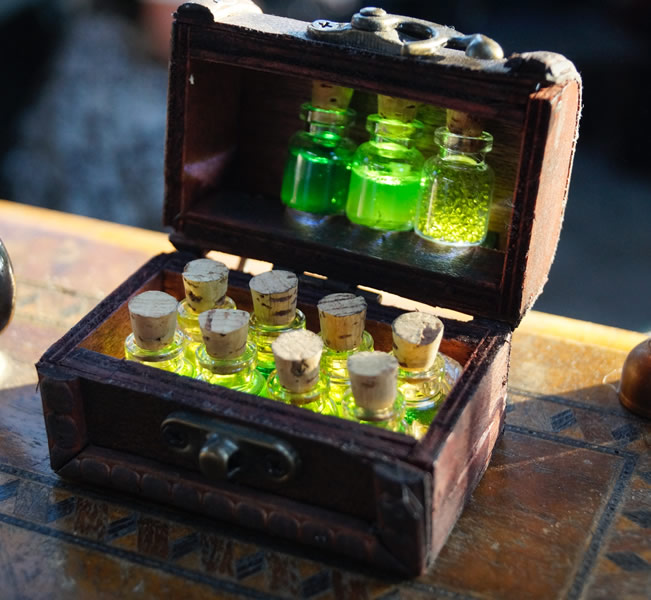 Glass bottles filled with liquid in a chest